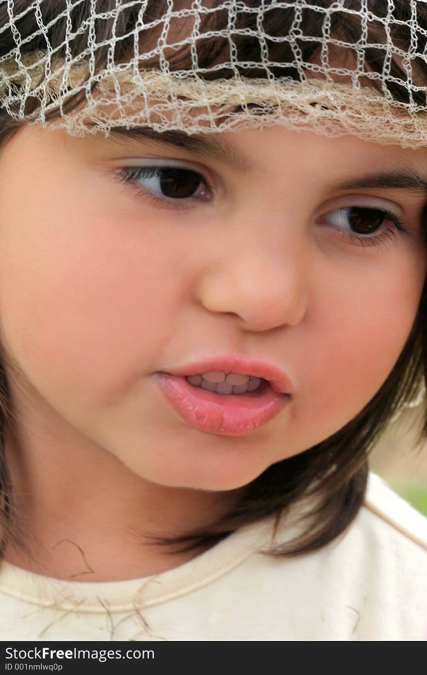 Face of a little girl with rosebud lips. Face of a little girl with rosebud lips.