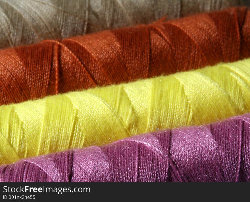 Close up image of colorful threads