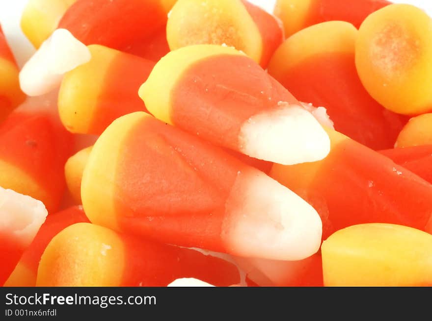 A close-up of a pile of candy corn. A close-up of a pile of candy corn