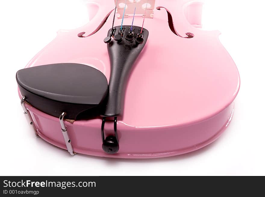 Isolated pink violin set against a white background (over white). Isolated pink violin set against a white background (over white).