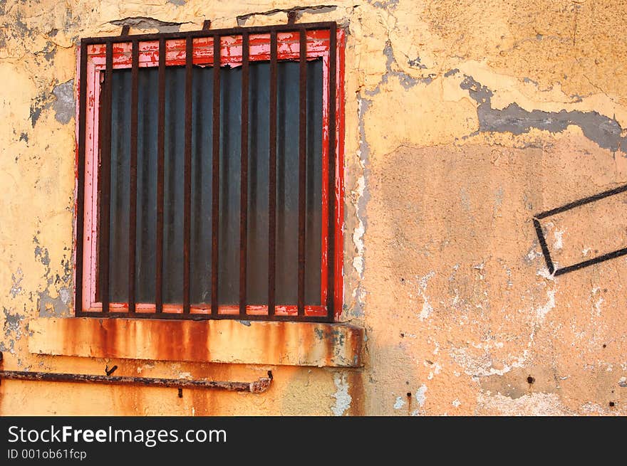 Old wall with red window