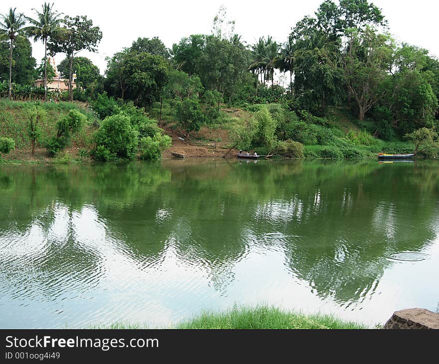 A beautiful scene of a greenery and reflection of water In Indian village. A beautiful scene of a greenery and reflection of water In Indian village.