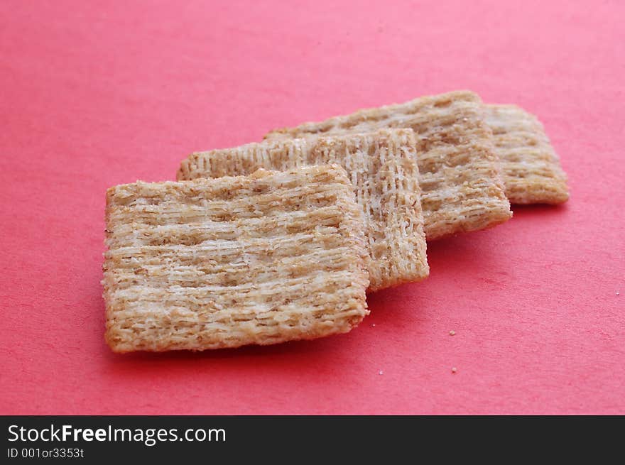 Some crackers on a red background. Some crackers on a red background.