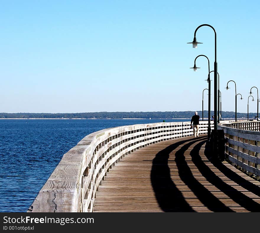 Walking the pier with shadows