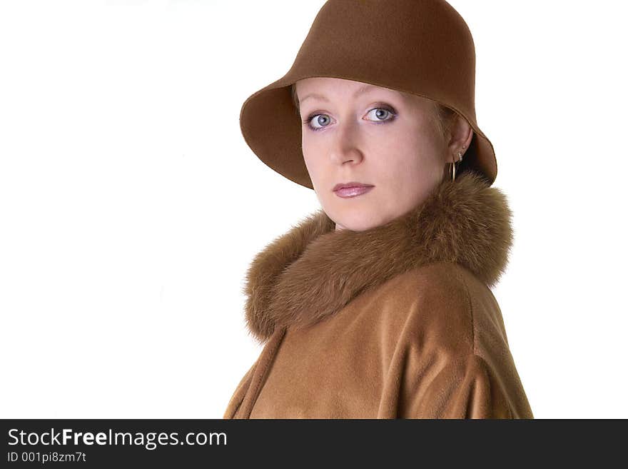 Elegant lady in hat and coat with fur