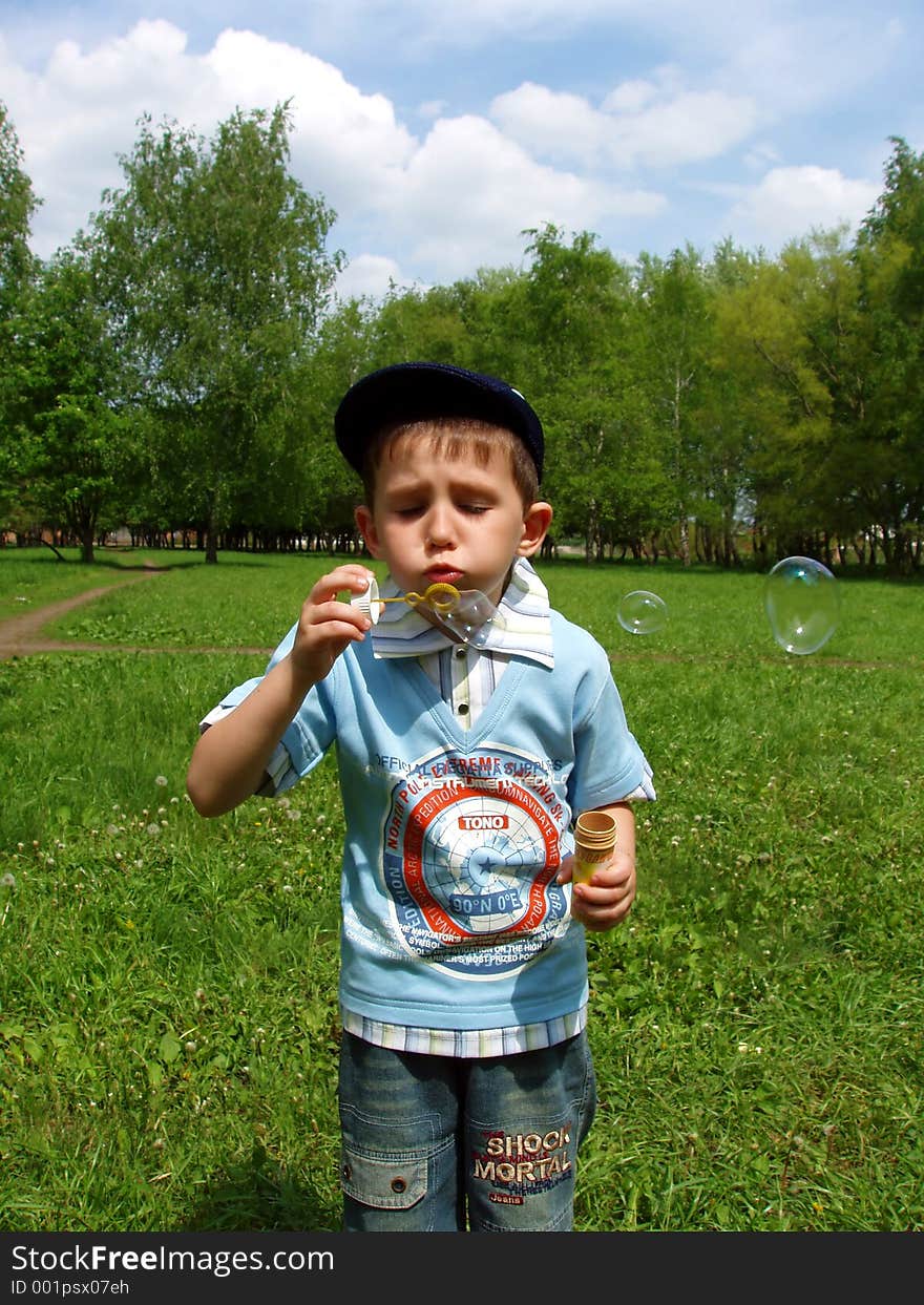 The boy and soap bubbles