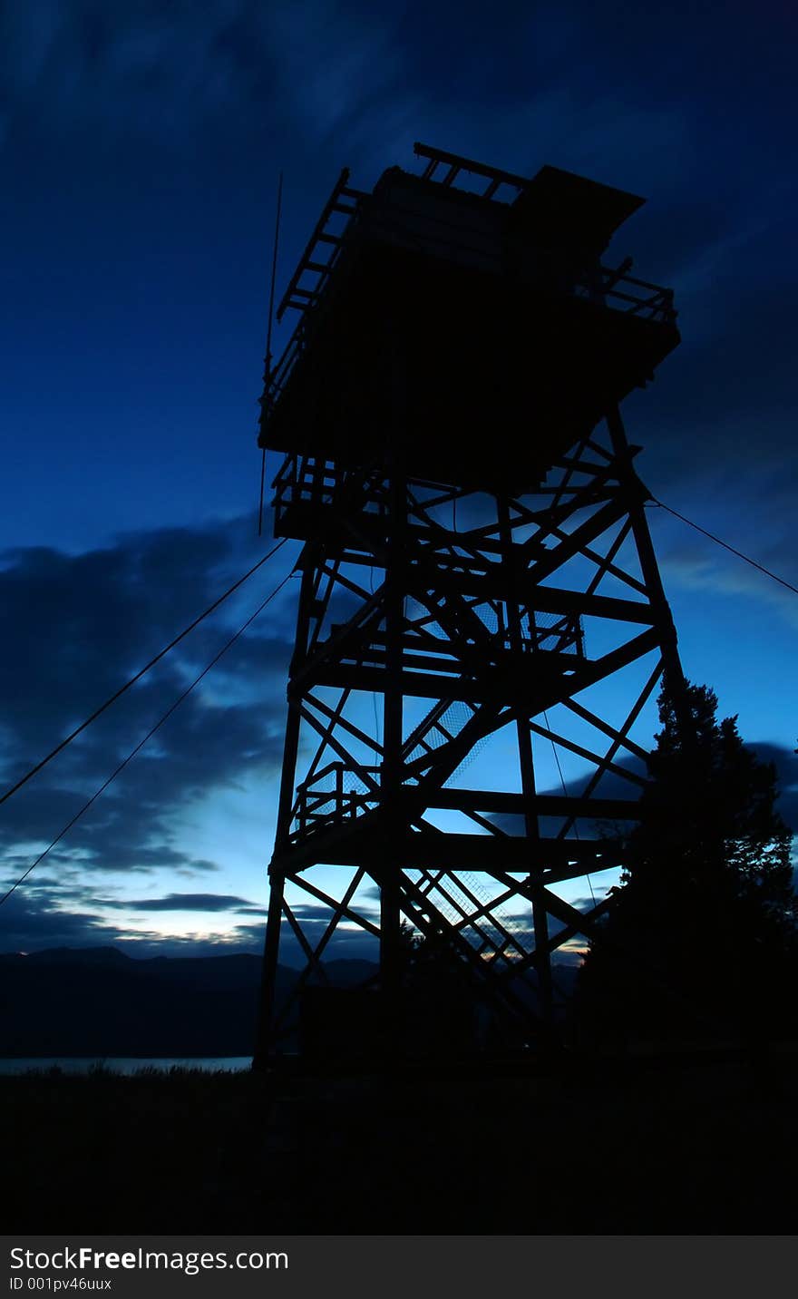 Fire Tower silhouetted against blue sky - dusk/sunset