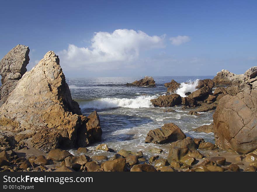 A wave crashing on the rocks of Corona del Mar, CA. A wave crashing on the rocks of Corona del Mar, CA