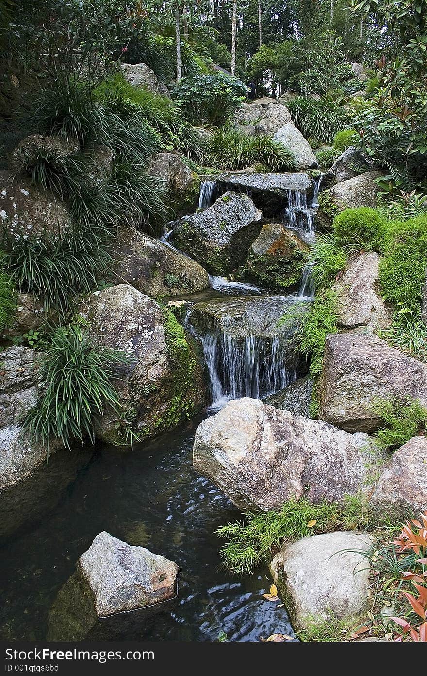 Artificial waterfall in Japanese garden.