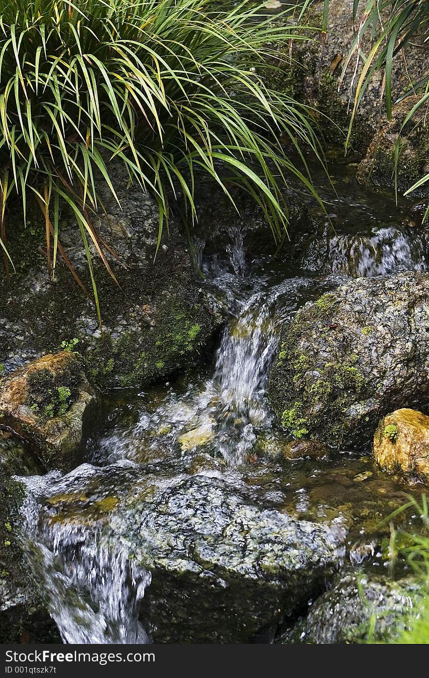 Manmade waterfall in Japanese garden.