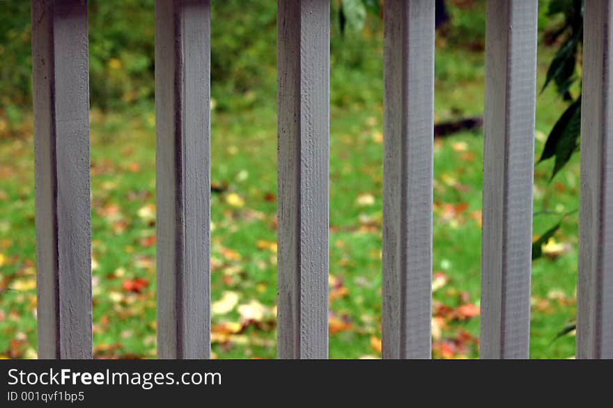 Straight white porch railings on a rainy day. Straight white porch railings on a rainy day