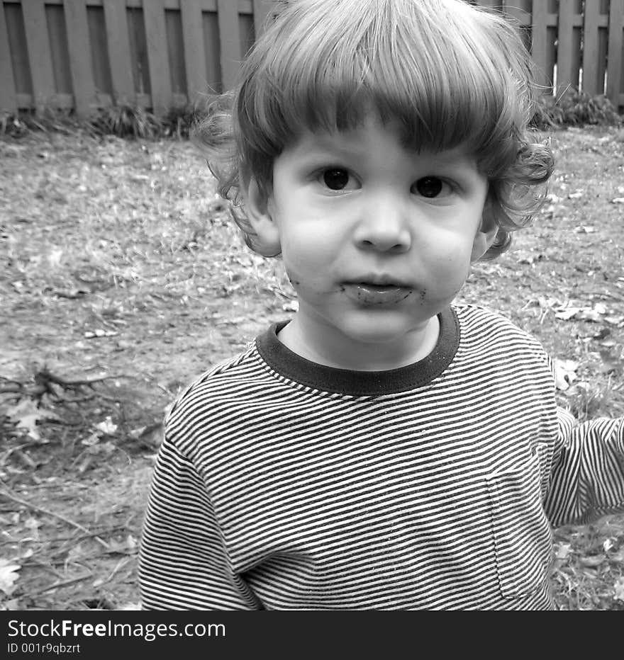 Little boy with dirt on his mouth. Little boy with dirt on his mouth