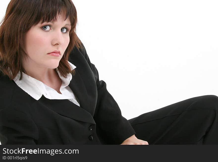 Smart and Beautiful young business woman. Shot in studio over white. Brown hair, blue eyes, black business suit. Smart and Beautiful young business woman. Shot in studio over white. Brown hair, blue eyes, black business suit.