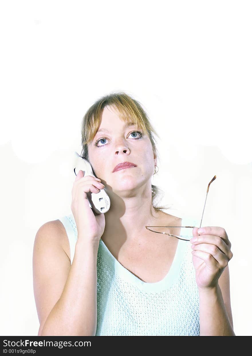 Isolated woman talking on phone with glasses. Isolated woman talking on phone with glasses