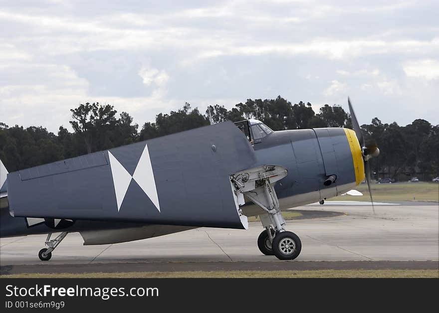 Grumman TBM-3R Avenger on the runway with its wings folded