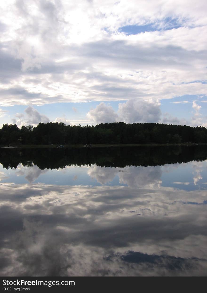 Reflections of the sky off a small lake on a clear day. Reflections of the sky off a small lake on a clear day