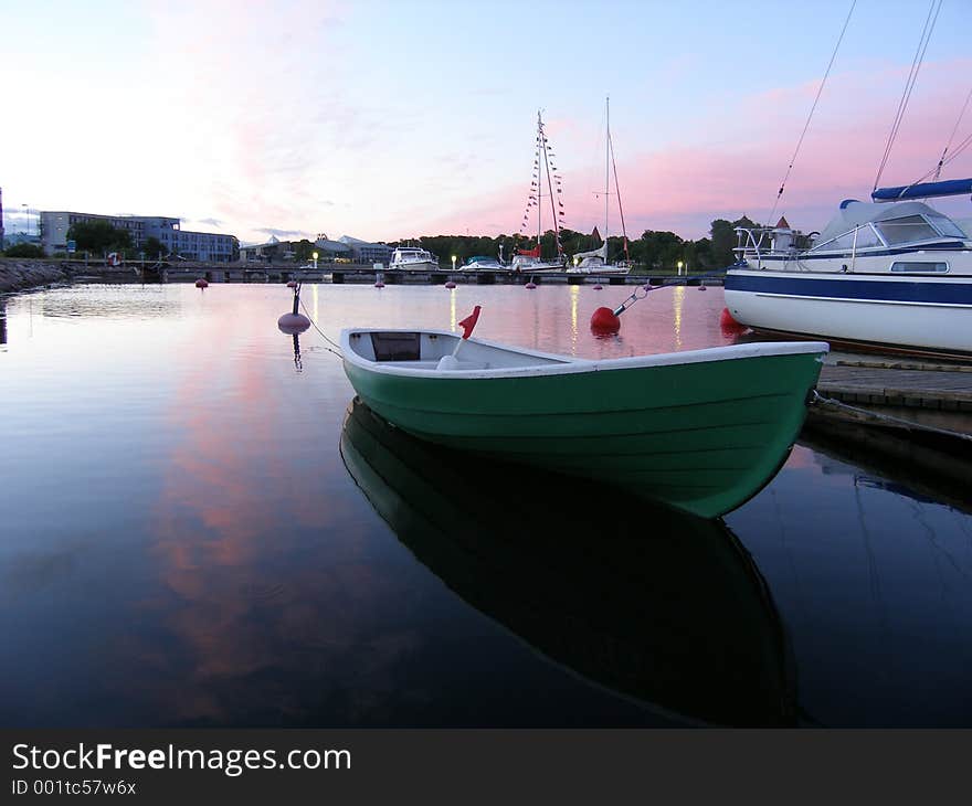 Small boat with sunset view