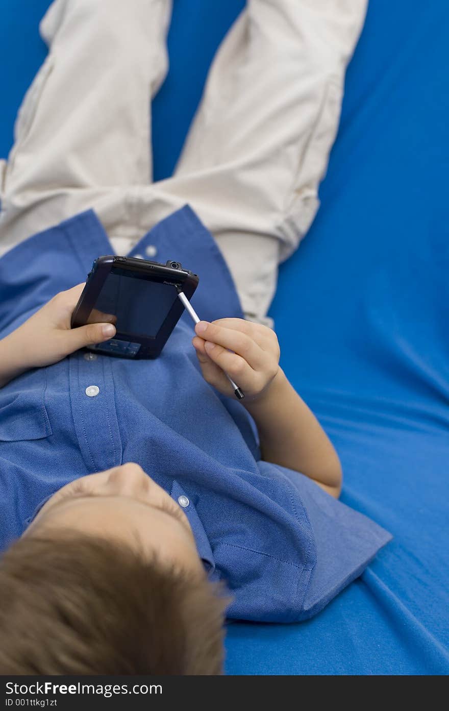 Soft focus on palmtop, sharp focus on the shirt. Soft focus on palmtop, sharp focus on the shirt