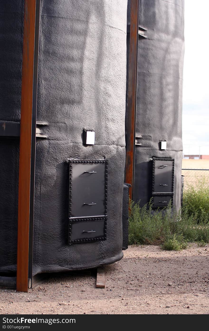 400BBL. Oil Storage Tanks. Exterior is foam insulated and sprayed black. Interior is coated with a corrosion resistant lining. Tanks are sitting on very corroded bare metal skids. 400BBL. Oil Storage Tanks. Exterior is foam insulated and sprayed black. Interior is coated with a corrosion resistant lining. Tanks are sitting on very corroded bare metal skids.