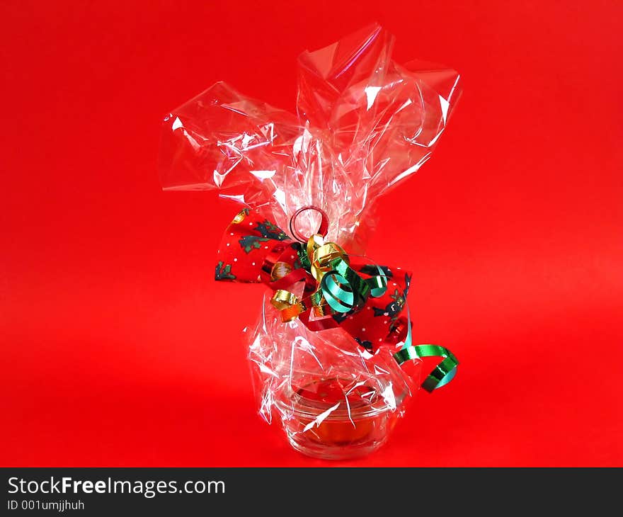 A present wrapped in colourfull ribbons. A present wrapped in colourfull ribbons