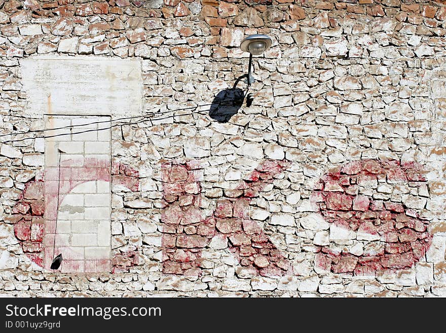 Side wall of an old and crumbling industrial building. Side wall of an old and crumbling industrial building