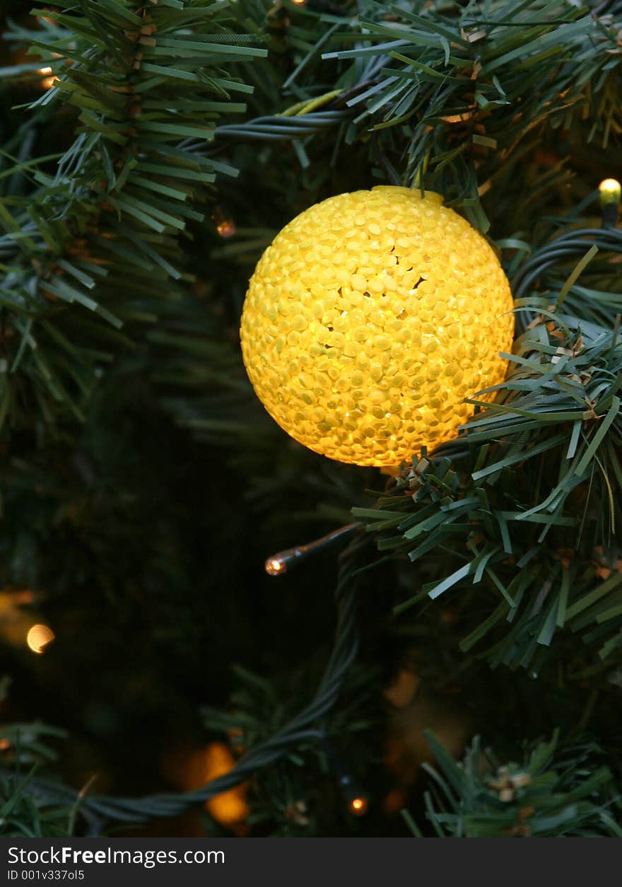 Yellow christmas tree ornamental ball. Yellow christmas tree ornamental ball