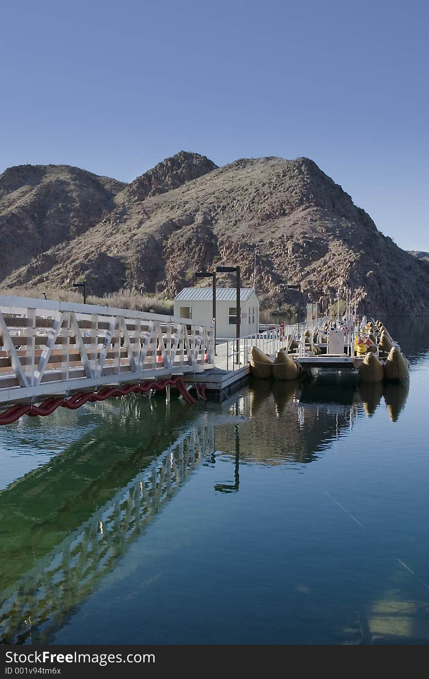 Dock for recreational pontoons on the Colorado River at Willow Beach in the desert. Dock for recreational pontoons on the Colorado River at Willow Beach in the desert