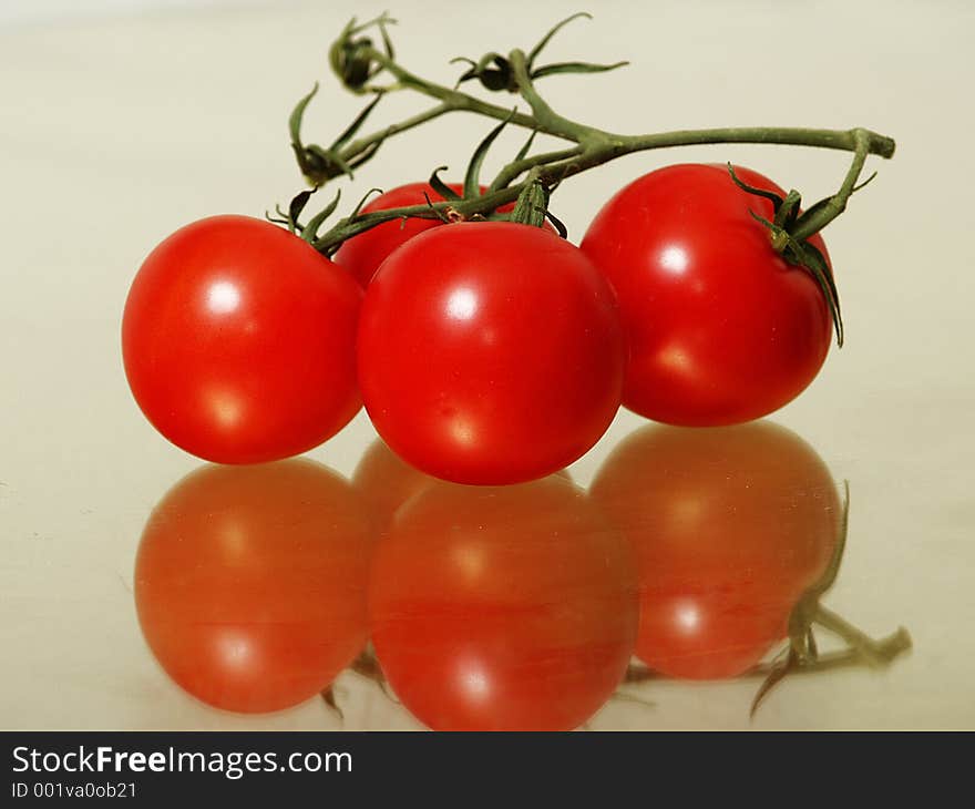 Tomatoes on the vine in color