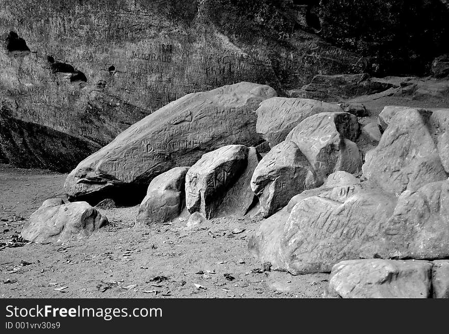 Black and white image of names carved into rocks. Black and white image of names carved into rocks.