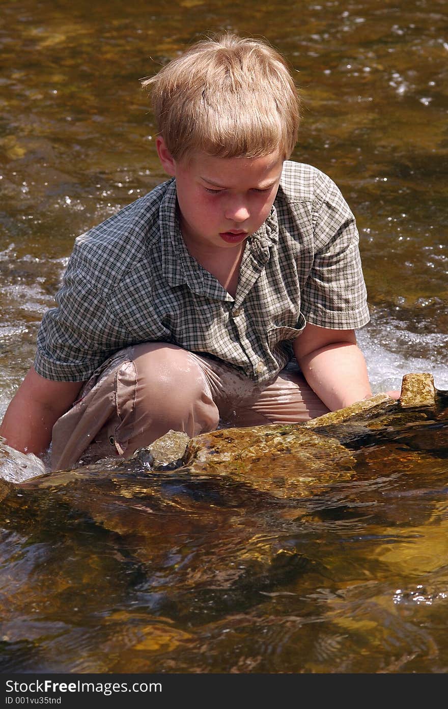 Boy cooling off in Minnehaha Creek. Boy cooling off in Minnehaha Creek