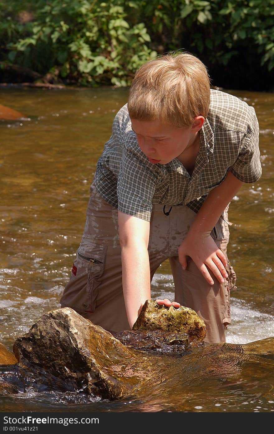 Playing in a creek on a hot summer day