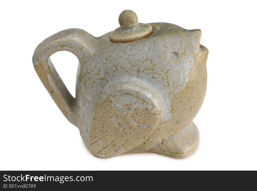 Bird shaped clay teapot with a short beak as a spout. Bird shaped clay teapot with a short beak as a spout