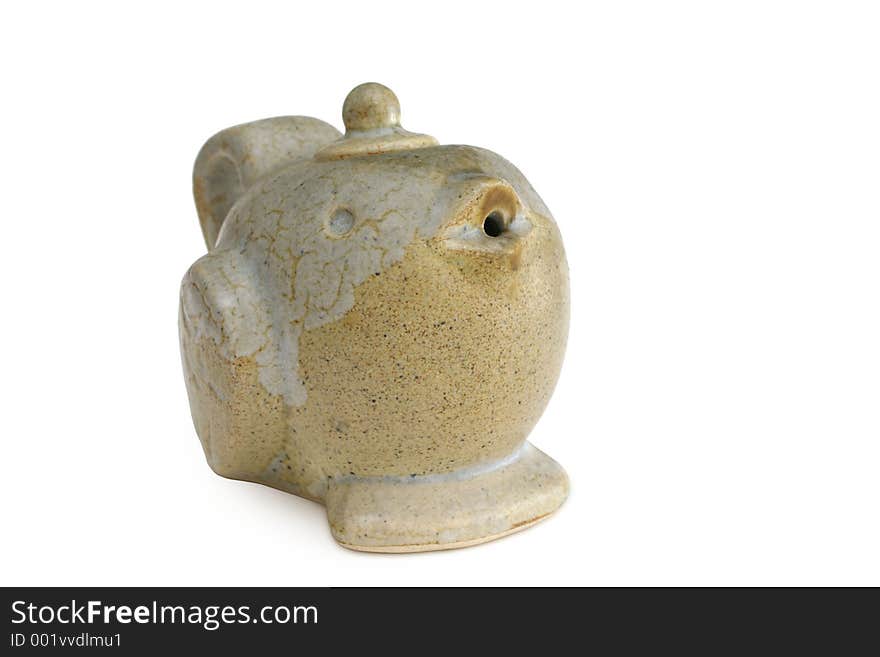 Bird shaped clay teapot with a short beak as a spout. Bird shaped clay teapot with a short beak as a spout