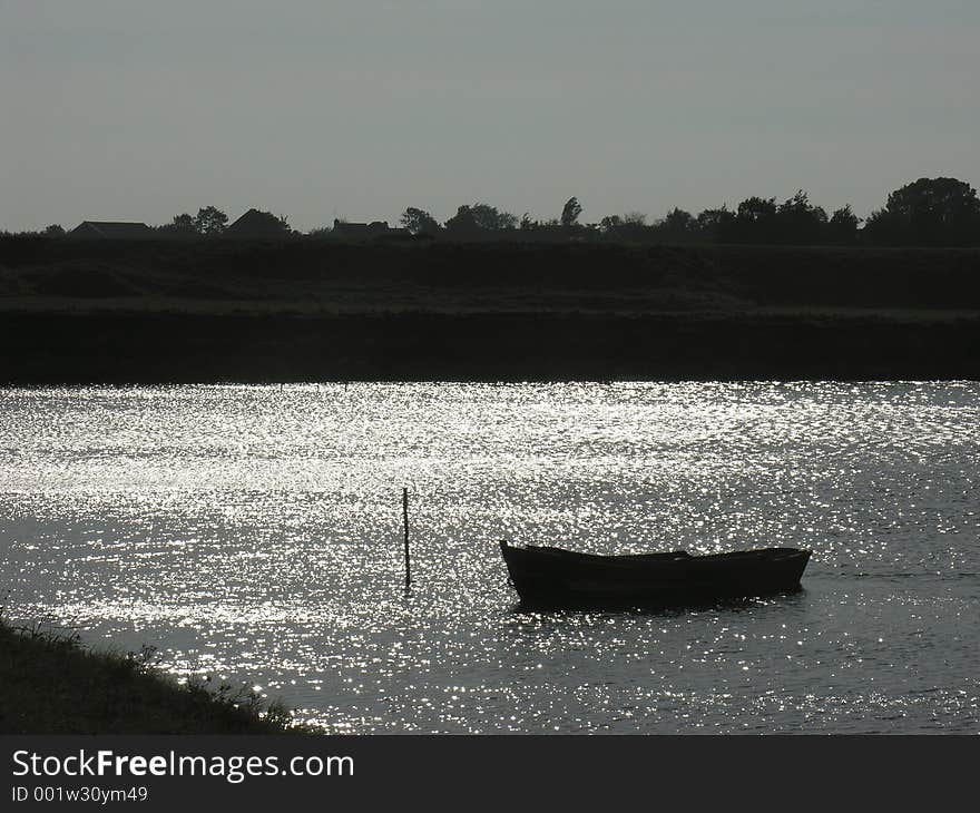 Rowboat in sunset on Texel, Holland