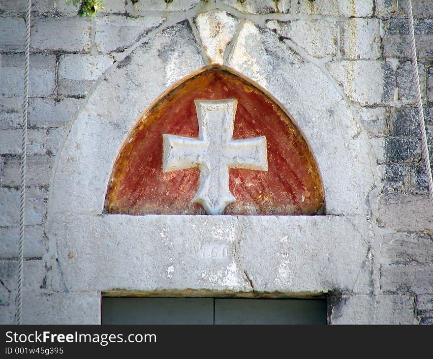 The cross above the church doorway