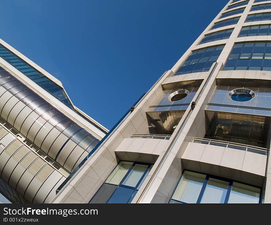 High modern building over the blue sky. High modern building over the blue sky