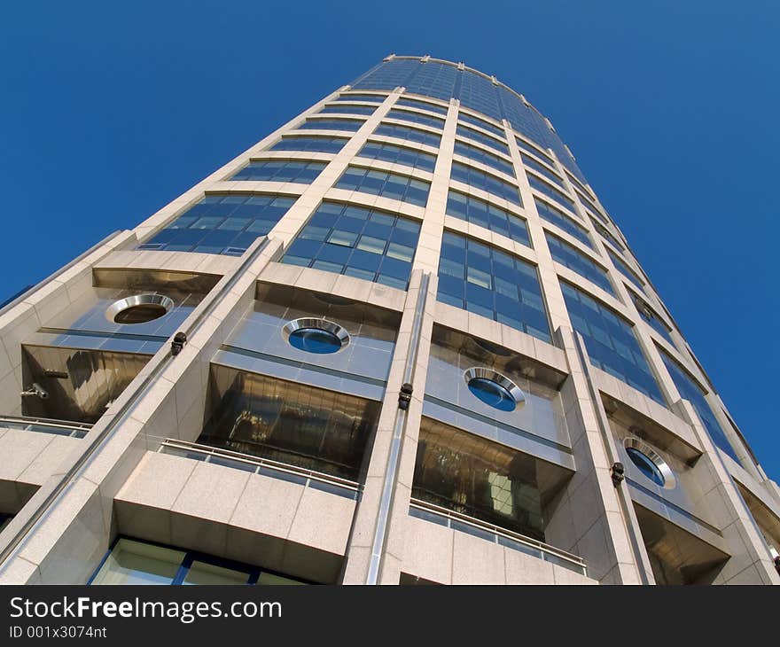 High modern building over the blue sky. High modern building over the blue sky