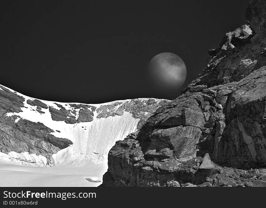 Moon rising over a mountain ridge. Moon rising over a mountain ridge