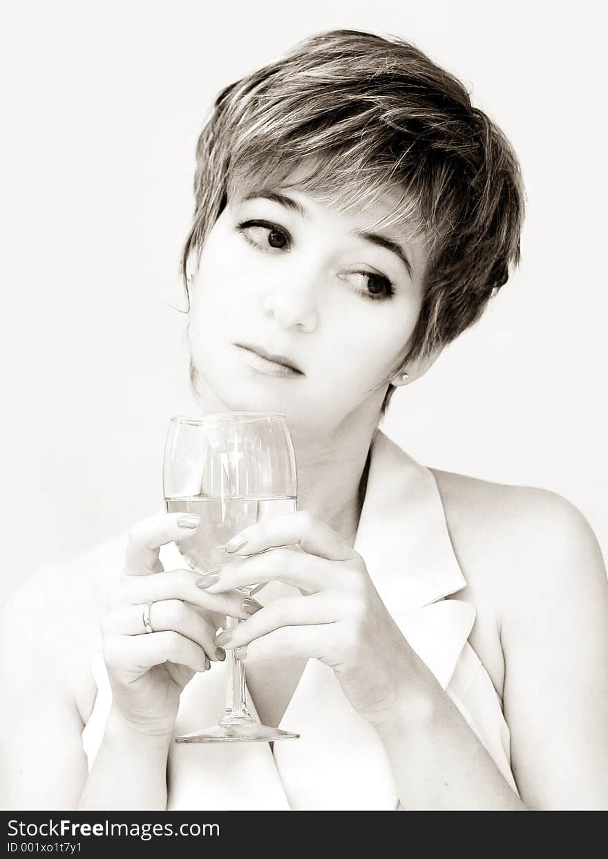 Woman in a formal dress having a glass of wine