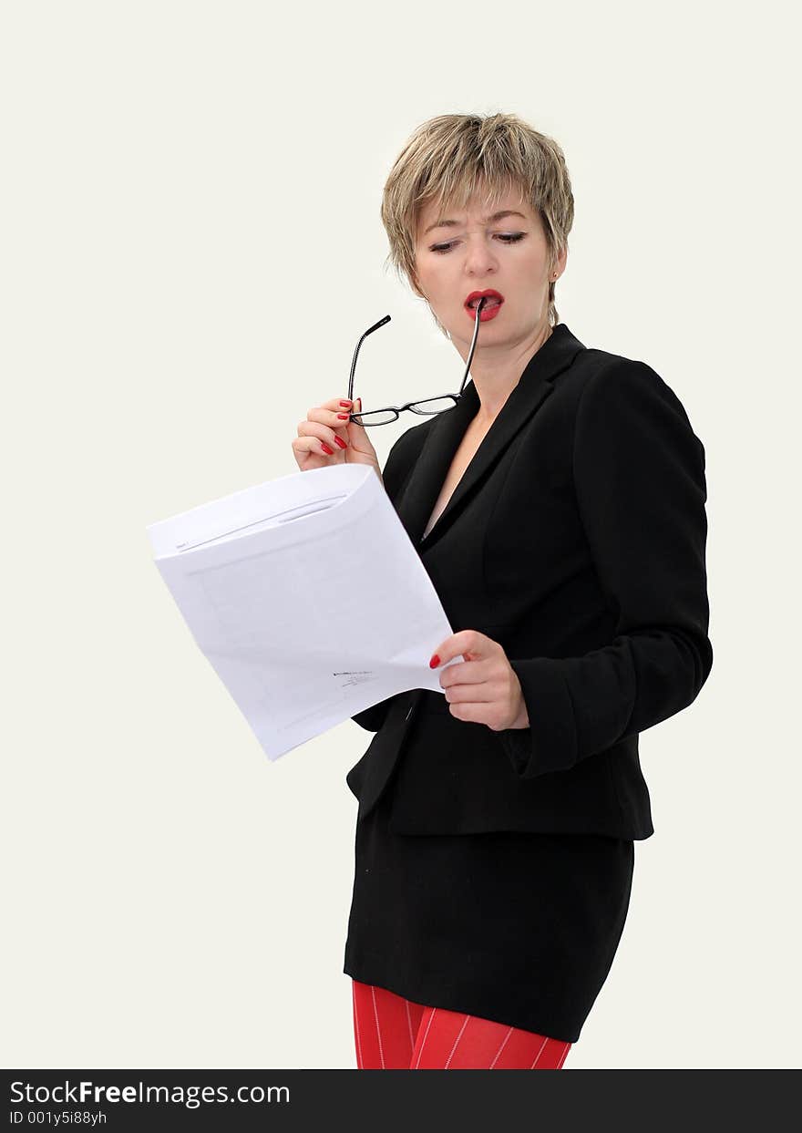 Businesswoman with eyeglasses reading a paper. Businesswoman with eyeglasses reading a paper