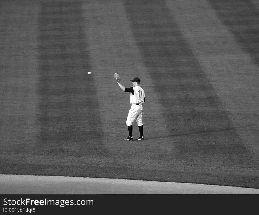 Local farm team Baseball player about to catch a baseball (B&W). Local farm team Baseball player about to catch a baseball (B&W)