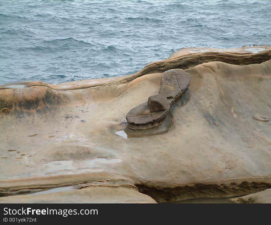 Sandal shaped rock at Yehliu, Taiwan. Sandal shaped rock at Yehliu, Taiwan