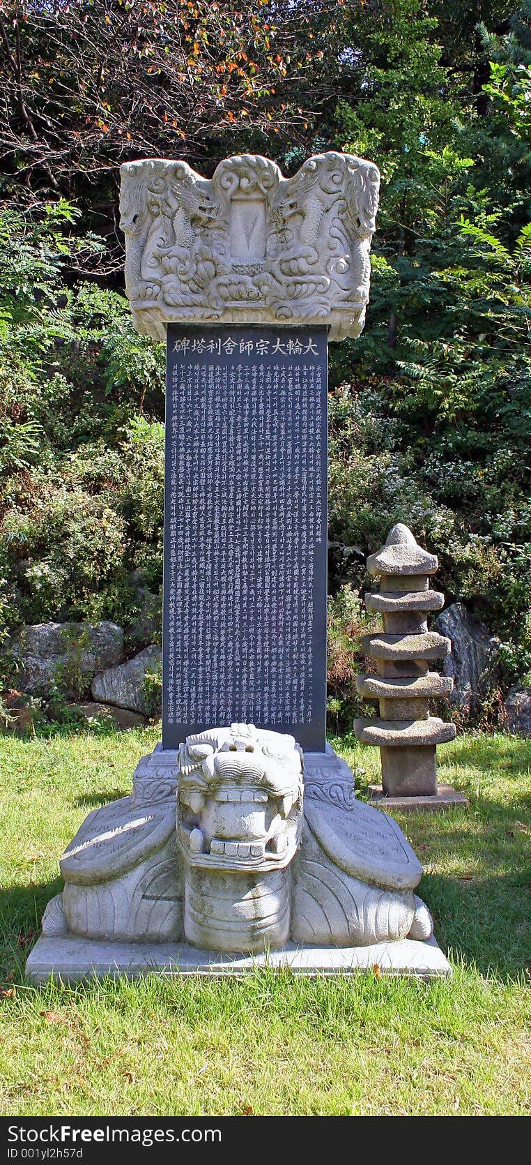 Stone monument with a turtle at the base