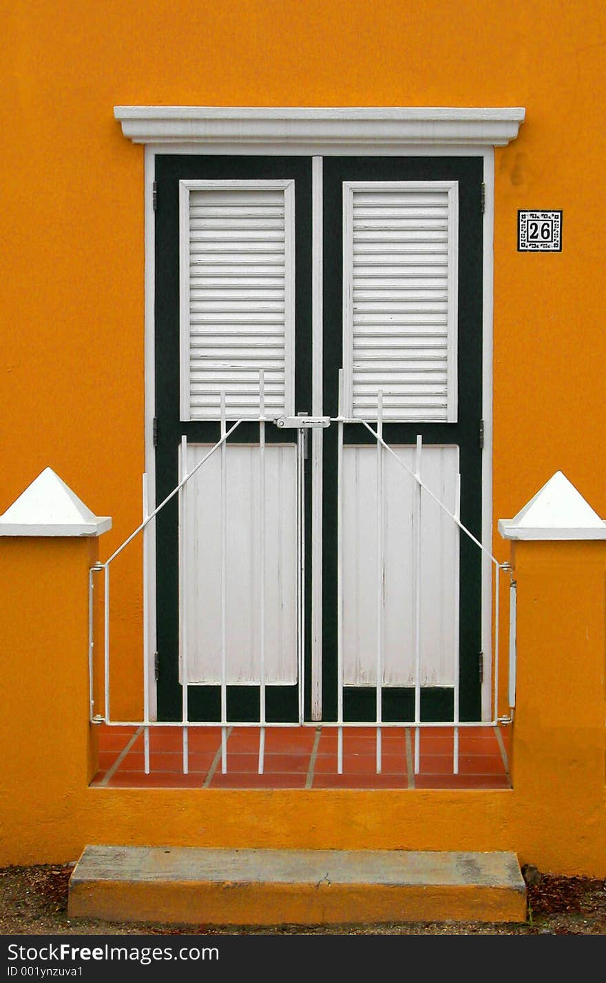 Front door of a home shuttered up for the winter. Front door of a home shuttered up for the winter