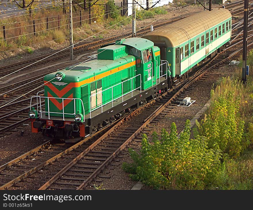 Diesel locomotive hauling railway car