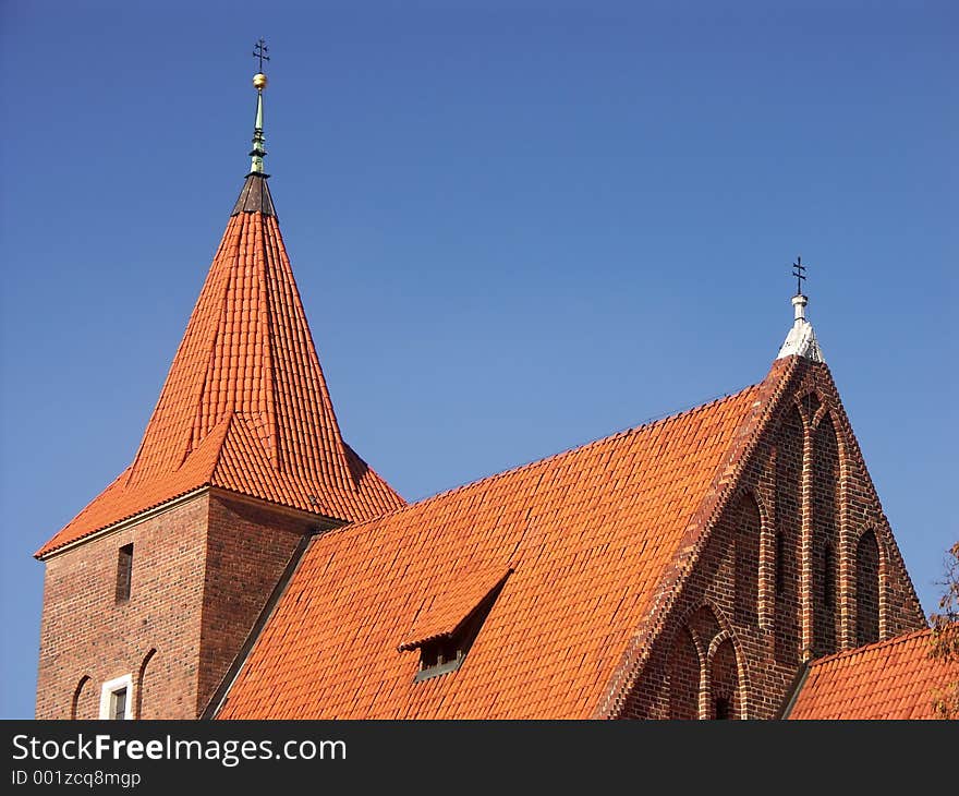 Roman Catholic church with red roof. Roman Catholic church with red roof