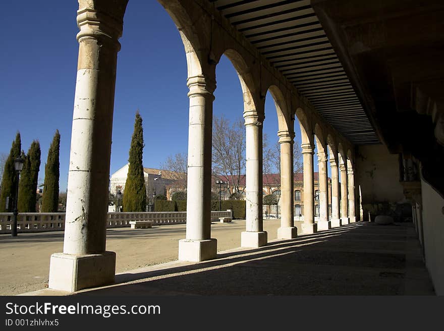 Light and shadows going through the archs of an old building.