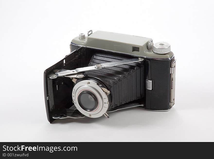 An old camera with bellows extended. Camera folds up for portability