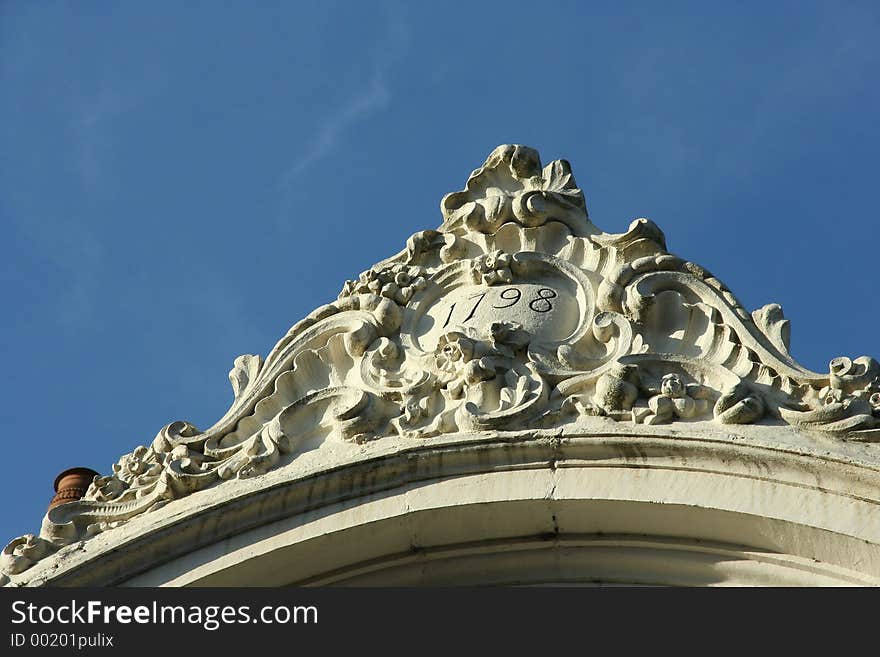 Detail of historic building rooftop (arch) with 1798 written on it. Picture taken in Bruges, Belgium. Detail of historic building rooftop (arch) with 1798 written on it. Picture taken in Bruges, Belgium