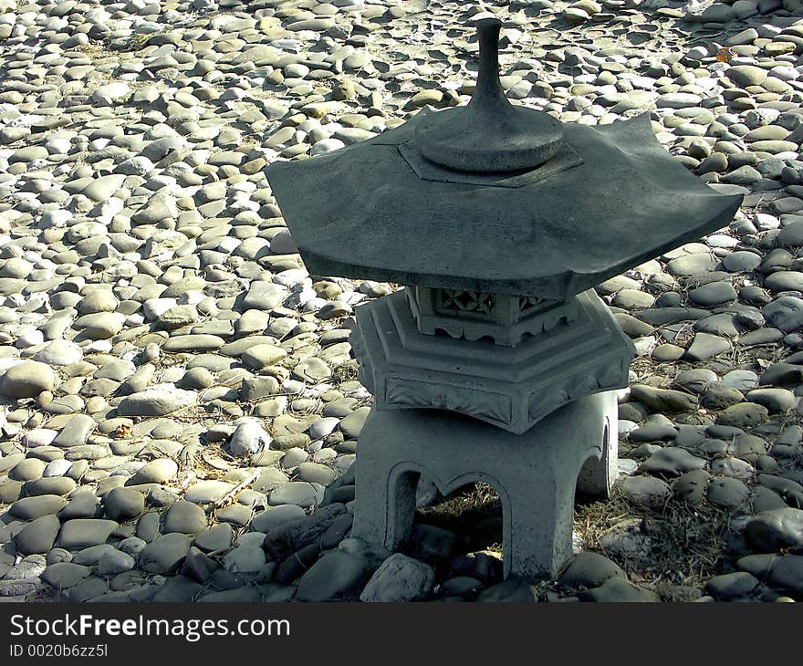 Japanese garden lamp in shadow. Japanese garden lamp in shadow